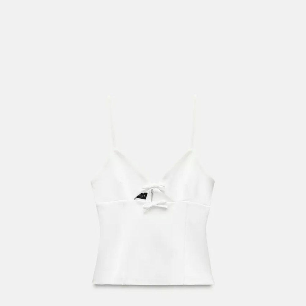 Cut out elastic top with bow cutouts & zipper back. New with tags. Never worn.